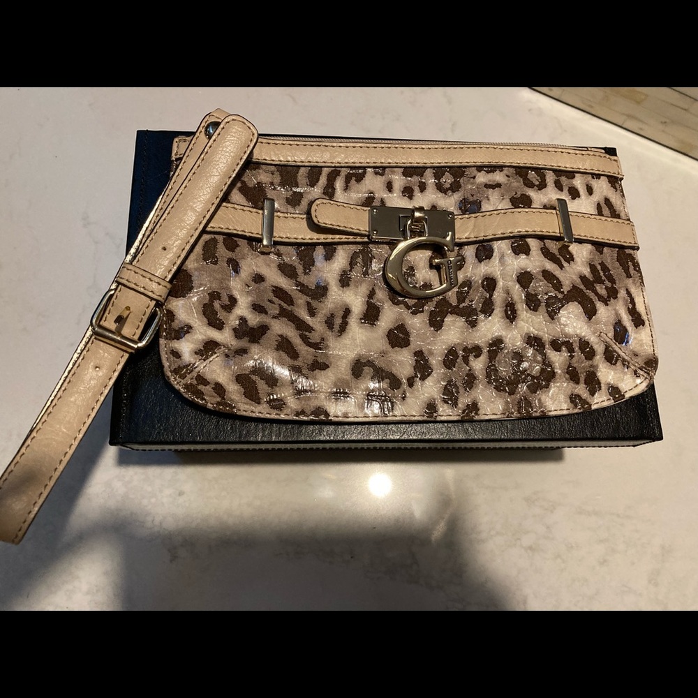 GUESS Wristlet in faux cheetah print